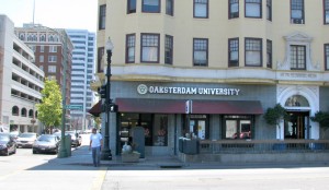 Oaksterdam University sign is still on this Oakland building, but the school was forced out of the building in the 2012 federal raid. (STAFF PHOTO / MICHAEL POLLICK)