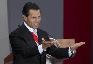 Mexico's President Enrique Pena Nieto gives his second state-of-the-nation address inside the National Palace in Mexico City, Tuesday, Sept. 2, 2014. (AP Photo/Eduardo Verdugo)