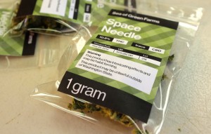 A one-gram packet of a variety of marijuana named "Space Needle" made by Sea of Green Farms in Seattle. Each packet is labeled with the percentage of THC, a lot number, and warning messages. (AP Photo/Ted S. Warren)