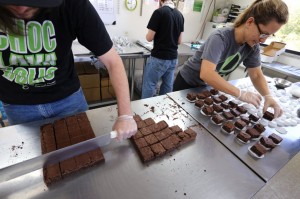 Smaller-dose pot-infused brownies are divided and packaged at The Growing Kitchen, in Boulder, Colo. (AP Photo/Brennan Linsley)  