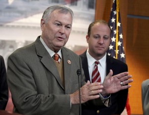 Rep. Dana Rohrabacher, R-Calif., left, accompanied by Rep. Jared Polis, D-Colo., speaks during a news conference on Capitol Hill in Washington, Thursday, Nov, 13, 2014, to discuss marijuana laws. Members of Congress from states with legal pot are banding together to tell their colleagues on Capitol Hill not to interfere with state drug laws. (AP Photo/Lauren Victoria Burke)