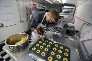 Alex Tretter, a chef in Denver, prepares cannabis-infused peanut butter and jelly cups. Colorado is calling for a change in the way edible marijuana is labeled. (Associated Press Photo