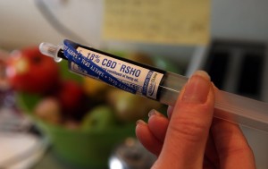 An oral administration syringe loaded with high CBD hemp oil for treating a severely-ill child is shown at a private home in Colorado Springs, Colo.  (AP Photo/Brennan Linsley)  