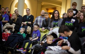 Parents of children who suffer from epilepsy attend a press conference on House Bill 1 at the state Capitol, Tuesday, Jan. 13, 2015, in Atlanta. Republican state Rep. Allen Peake announced Friday that he would scale back planned legislation on the bill, which would have regulated use and production of medical cannabis oil to treat certain medical conditions in Georgia, to now giving immunity to people possessing the oil purchased in other states. Some families remain worried about being arrested with the oil while traveling across state lines. (AP Photo/David Goldman)   David Goldman