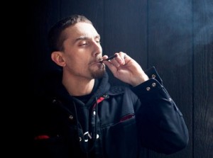 Joe Good, a sales representative for JuJu Joints, at a lounge in Seattle showing how the product, a disposable electronic vapor marijuana cigarette, works. A JuJu Joint is disposable and comes filled with 150 hits. There is no smoke and no smell. Credit Matthew Ryan Williams for The New York Times