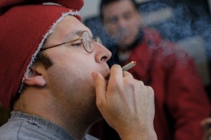 Adam Eidinger, chairman of the DC Cannabis Campaign, smokes a joint at a news conference about marijuana decriminalization in Washington, Feb. 26, 2015. The possession of small amounts of marijuana became legal Thursday in the District of Columbia, though it remains illegal to sell or buy — “Legalization without commercialization,” according to Eidinger. (T.J. Kirkpatrick/The New York Times) 