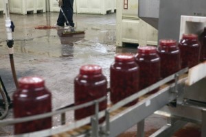A worker cleans the floor of the Dell’s Maraschino Cherries plant in the Red Hook neighborhood of New York. Investigators say the thriving factory also concealed the largest marijuana-growing operation ever discovered in New York City, the unearthing of which prompted the thriving factory’s third-generation owner, Arthur Mondella, to commit suicide abruptly on Feb. 25, 2015. (Richard Perry/The New York Times) 
