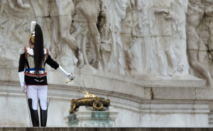 A Cuirassier presidential guard stands to attention at the Vittoriano Unknown Soldier monument prior to the arrival of newly elected Italian President Sergio Mattarella in Rome, Tuesday, Feb. 3, 2015. Italy's new president, Sergio Mattarella, has taken the oath of office with a vow to fight corruption and organized crime and encourage the nation to embrace economic and electoral reform. The new head of state, whose brother, Piersanti Mattarella, was slain while governor of Sicily by the Mafia in 1980, denounced as "alarming" the spread of the Mafia from its traditional base in the south to northern cities. Mattarella, in his speech to Parliament Tuesday, also decried pervasive corruption, which he said robs citizens of resources meant for them and upsets market rules, "penalizing the honest and the capable." (AP Photo/Andrew Medichini)