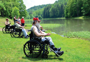 Veterans from the West Virginia Veterans Nursing Facility in Clarksburg, W.V., enjoy a day of fishing at the Joanne Sportman's Club in Rachel, W.V.,, Thursday, May 28, 2015. It is the first time the Joanne's Sportman's Club has offered a veterans fishing day but are planning another event later this year. (AP Photo/Times West Virginian, Tammy Shriver)