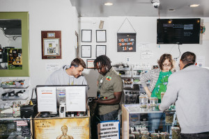 Customers at one of Bruce Nassau's five marijuana shops in Denver, April 19, 2015. The country's rapidly growing marijuana industry is forced to pay crippling federal income taxes because of a decades-old law aimed at preventing drug dealers from claiming their smuggling costs and couriers as business expenses on their tax returns. (Benjamin Rasmussen/The New York Times)