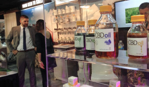 Oil containing CBD from agricultural hemp is displayed at the Marijuana Business Conference & Expo in Chicago. (AP Photo/Carla K. Johnson)