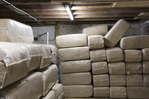Bagged hemp chips in James Savage's basement that will be mixed with lime and turned into a paste that then dries in place, called hempcrete, in Stuyvesant, N.Y., July 3, 2015. Now that the forbidden plant is enjoying mainstream acceptance, Savage is hoping to put hemp to use not in joints but between joists with hempcrete – a woody, balsa-like interior of the Cannabis sativa plant combined with lime and water that provides natural insulation. (Preston Schlebusch/The New York Times)