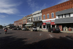 Shops on the town square open for business in Albion, Ill. In Albion, stores can't sell package liquor, but marijuana has been welcomed as a badly needed source of jobs. (AP Photo/Seth Perlman)