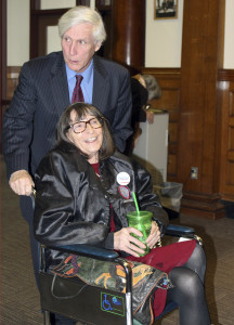 Linda Horan arrives with her lawyer Paul Twomey, rear, for a hearing at Merrimack County Superior Court Thursday, Nov. 12, 2015, in Concord, N.H.  Horan, in late-stage of lung cancer, seeks a court to provide her a medical marijuana identification card before dispensaries open next year in New Hampshire. The card would permit her to obtain marijuana in Maine, which serves patients who have registry cards in their home states. (AP Photo/Lynne Tuohy)