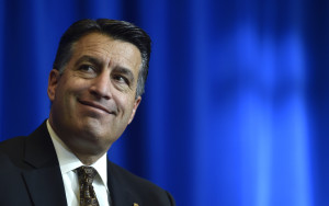 Nevada Gov. Brian Sandoval appears at a news conference on Thursday, Dec. 10, 2015, in Las Vegas. Sandoval announced plans for Faraday Future, a Chinese-backed electric carmaker's $1 billion manufacturing plant to be built in North Las Vegas, Nev. (AP Photo/David Becker)