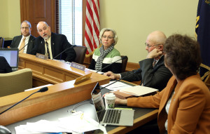 Members of the Senate Corrections and Juvenile Justice Committee led by committee chairman Sen. Greg Smith, R-Overland Park, second from left, sent bills to the Senate floor Tuesday, Jan. 26, 2016, to lessen penalties for marijuana possession and allow individuals with epilepsy to try hemp oil. (Thad Allton/The Topeka Capital-Journal via AP) 